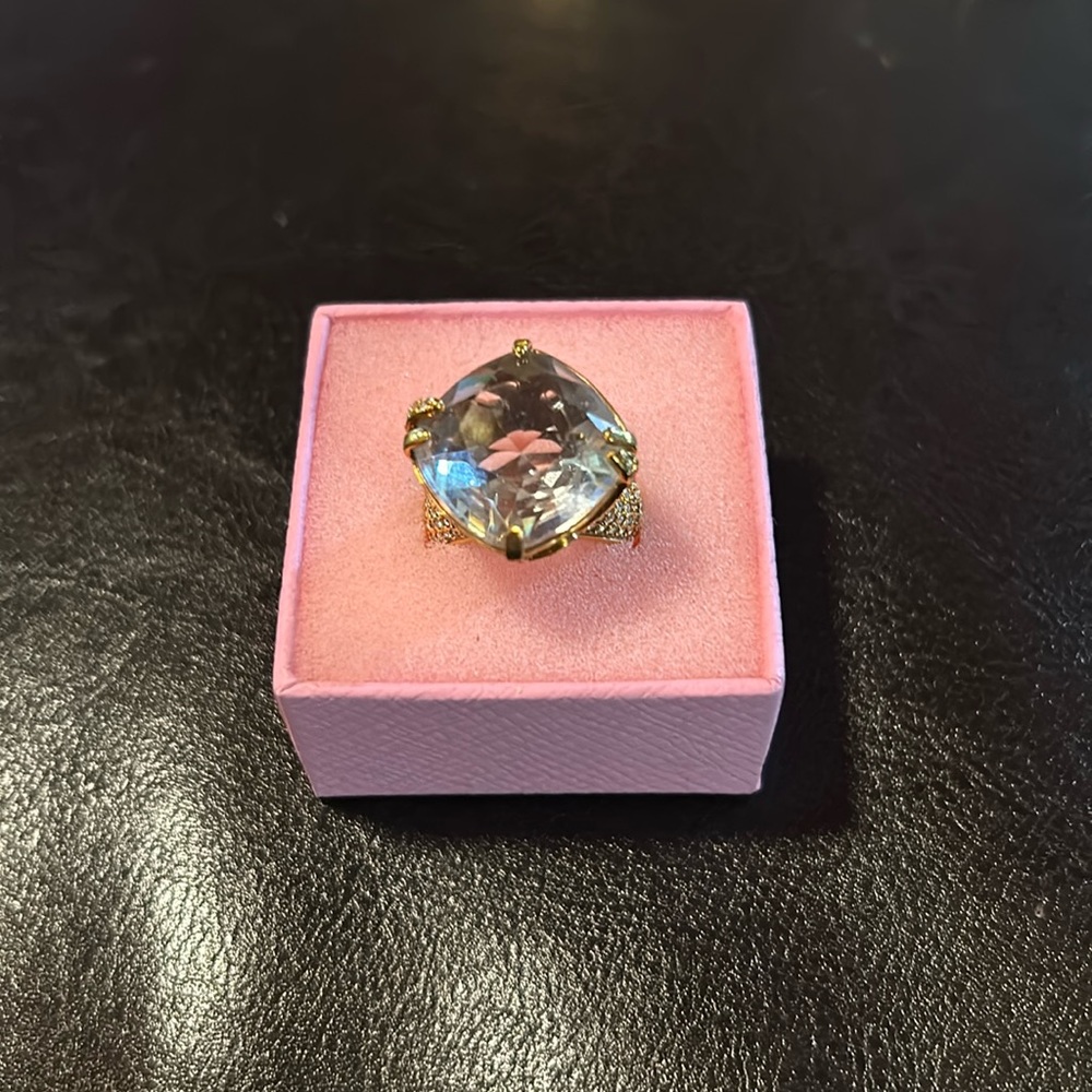Gold tone and rhinestone ring with large center stone